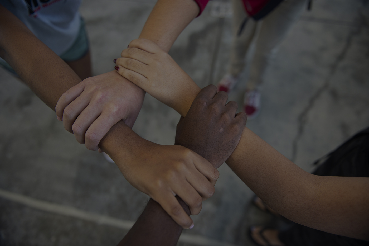 Diverse hands join together in solidarity, symbolizing community unity and collaboration for social equity initiatives.