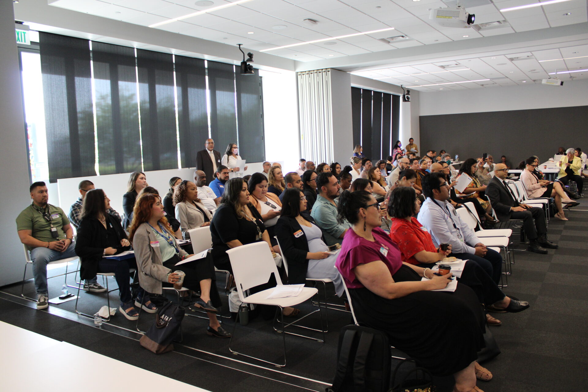 Group of people watching a presentation