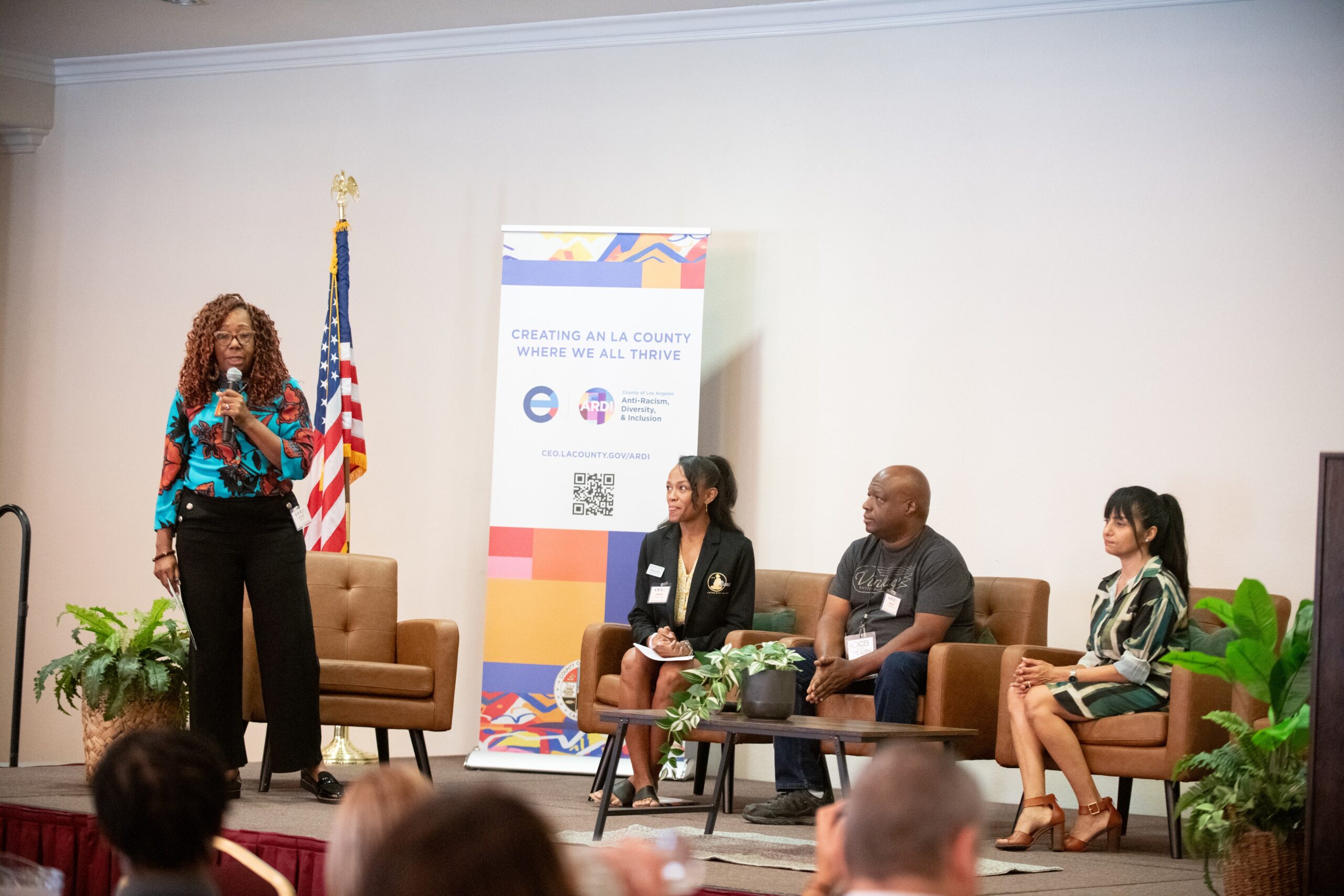 A panel discussion on community engagement featuring diverse speakers addressing equity initiatives in Los Angeles County.