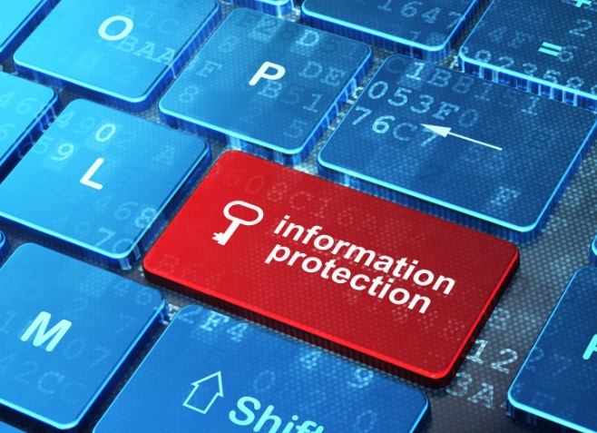 A close-up of a computer keyboard highlighting a red key labeled "information protection," symbolizing data security.